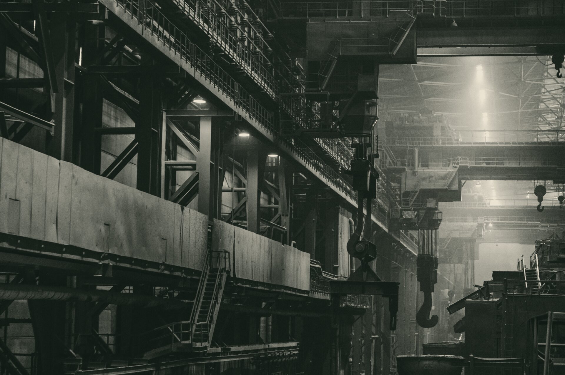 The interior of a heavy industrial plant, lit from above